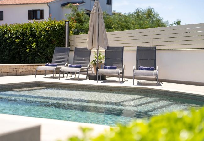 Villa in Varvari - Villa Anni for 10 people in Porec with heated pool, sea view & kids room and playground Villa in Varvari - Villa Anni for 10 people in Porec with heated pool, sea view & kids room and playground