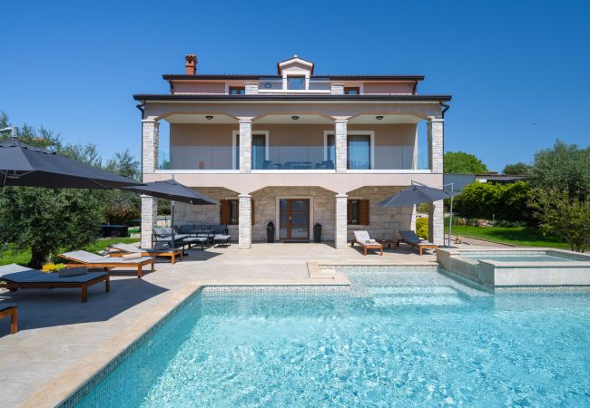 Вилла на Valentici - Villa Gambin near Poreč for 8 persons with private 36 m2 pool, whirlpool, kids playground & sea view